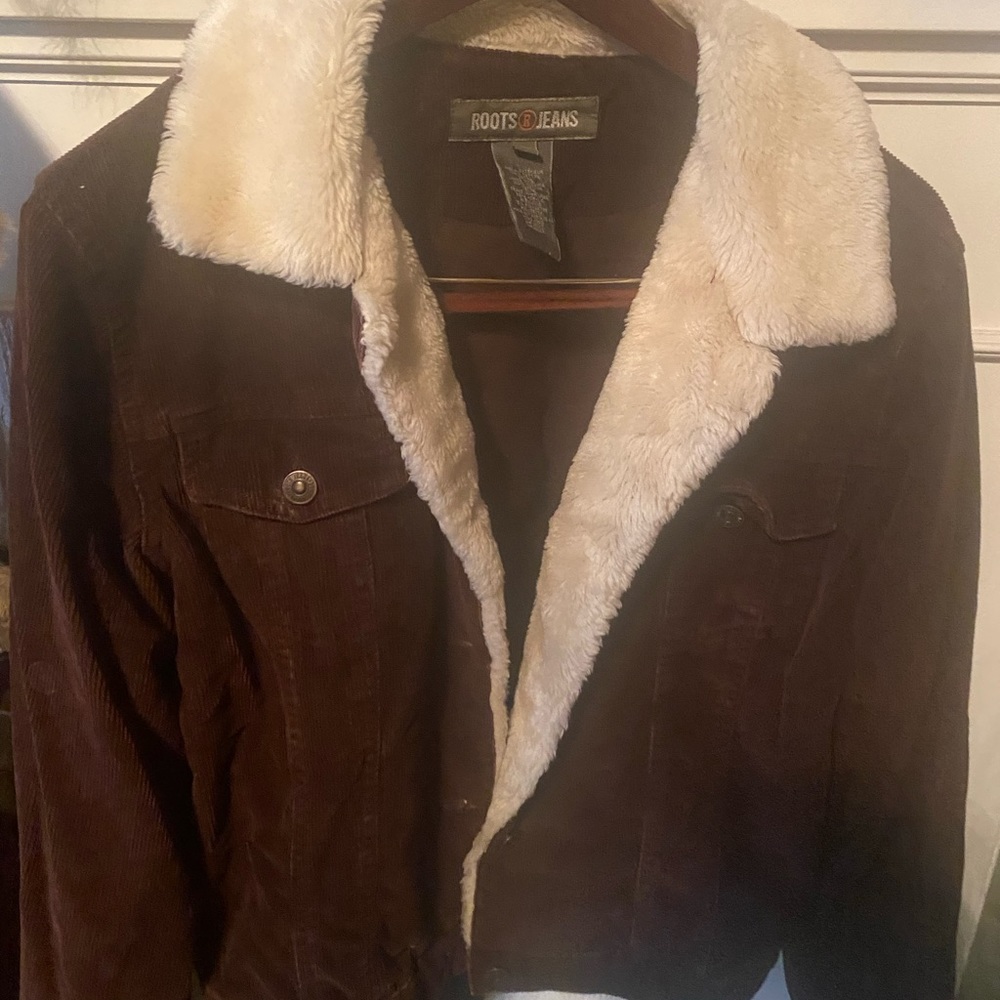 Canadian roots brand jacket with fur around collar.